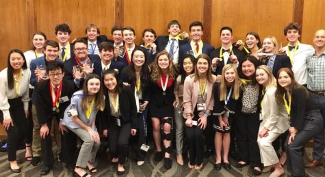 Lake Oswego DECA students pose with their awards after a successful tournament.