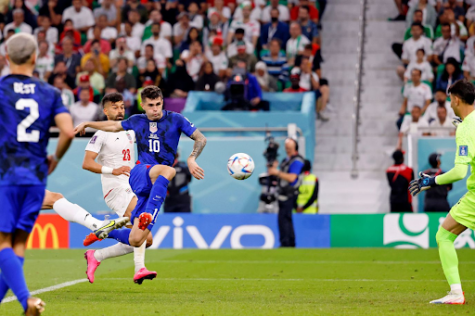 Christian Pulisic(10) scores against Iran to advance the US to the Round of 16.